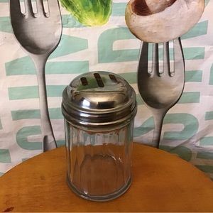 Vintage ribbed glass cheese shaker.